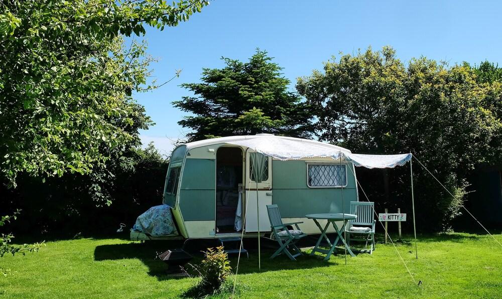 Kitty Unique 60s Caravan set in Pretty Garden Exterior