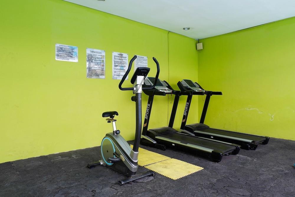 Trendy and Tidy Studio Room at Puri Mas Apartment Gym
