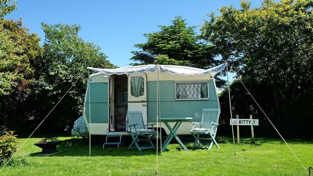 Kitty Unique 60s Caravan set in Pretty Garden Property Grounds