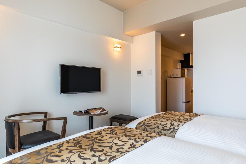 Mr.KINJO in front of Manza Beach Room
