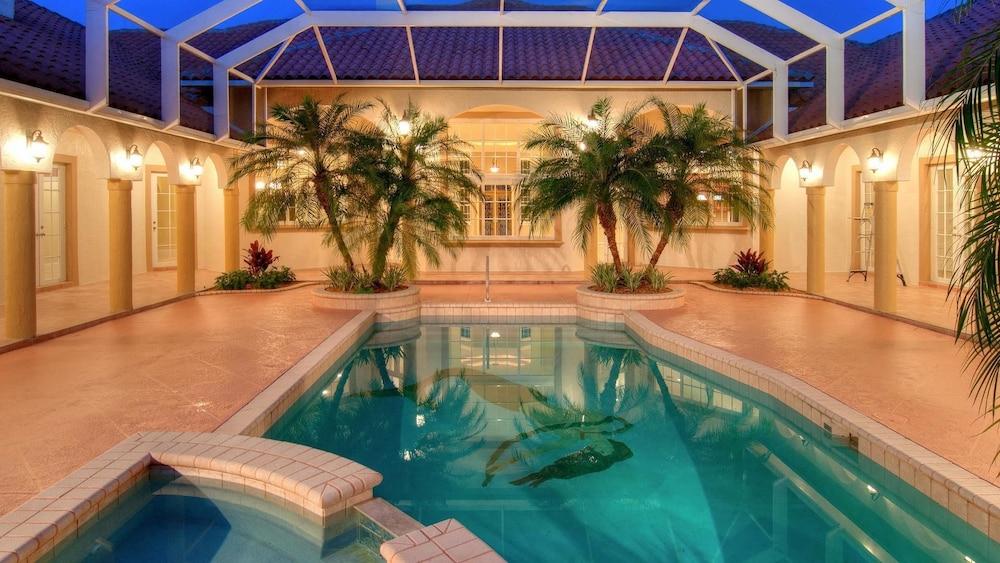 Knickerbocker Estate: Elegant 9-BR Getaway in Naples. Enjoy Private Pool, Outdoor Dining, and Expansive Grounds, Experience Tranquility with Easy Access to Naples' Best Indoor Pool