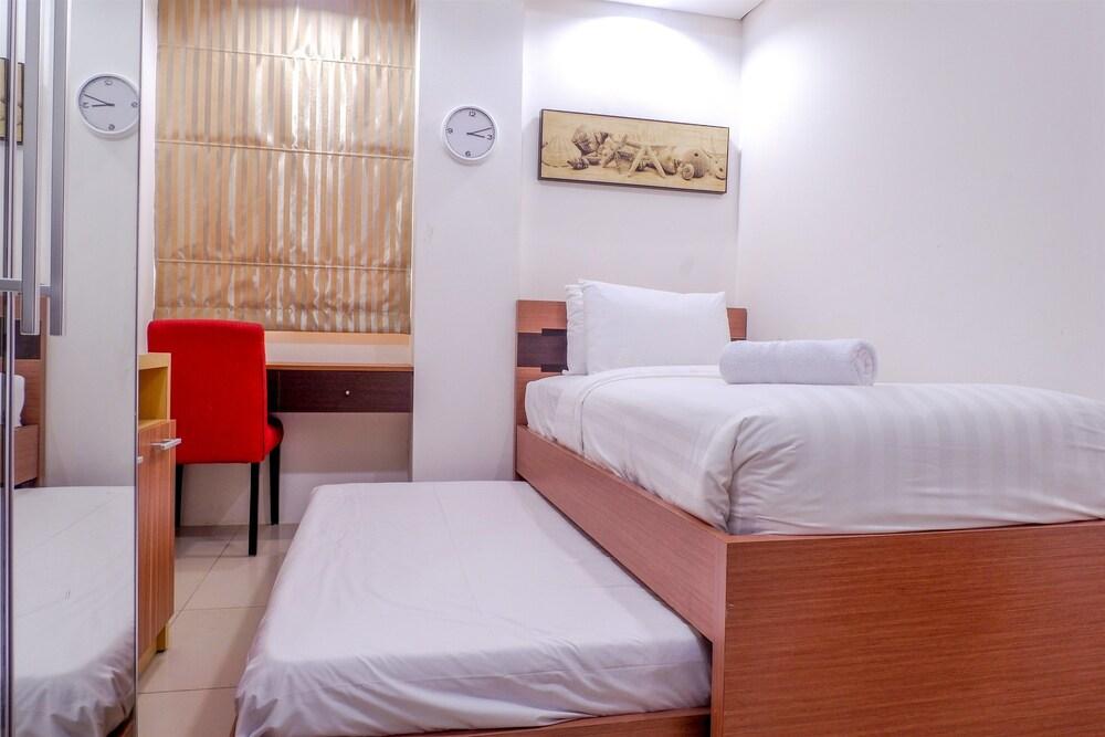 Cozy Pool View Kemang Village Residence Apartment with Direct Access to Mall Room