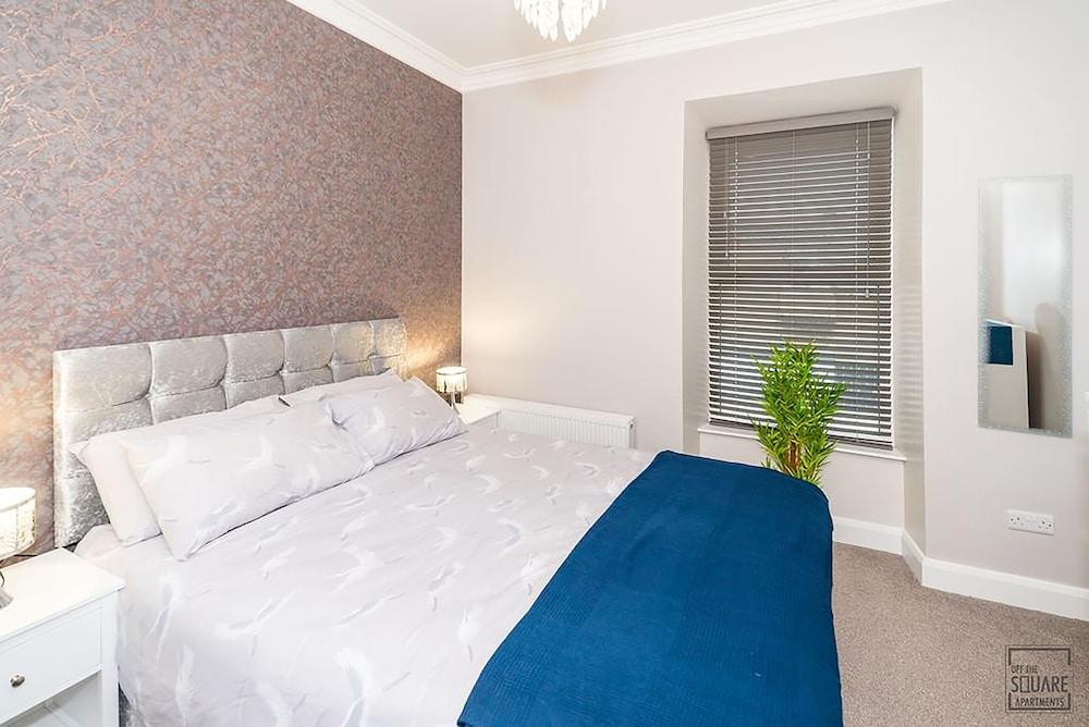 Off The Square Apartments Room