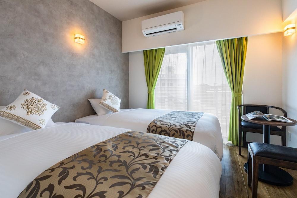 Mr.KINJO in front of Manza Beach Room