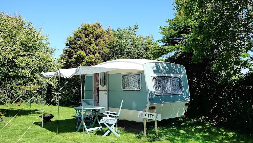 Kitty Unique 60s Caravan set in Pretty Garden Featured Image