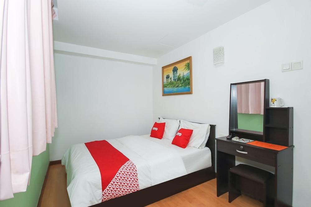 OYO 90345 TM Hotel - Featured Image