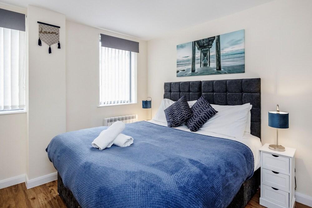 Real - Queens Serviced Apartments - Featured Image