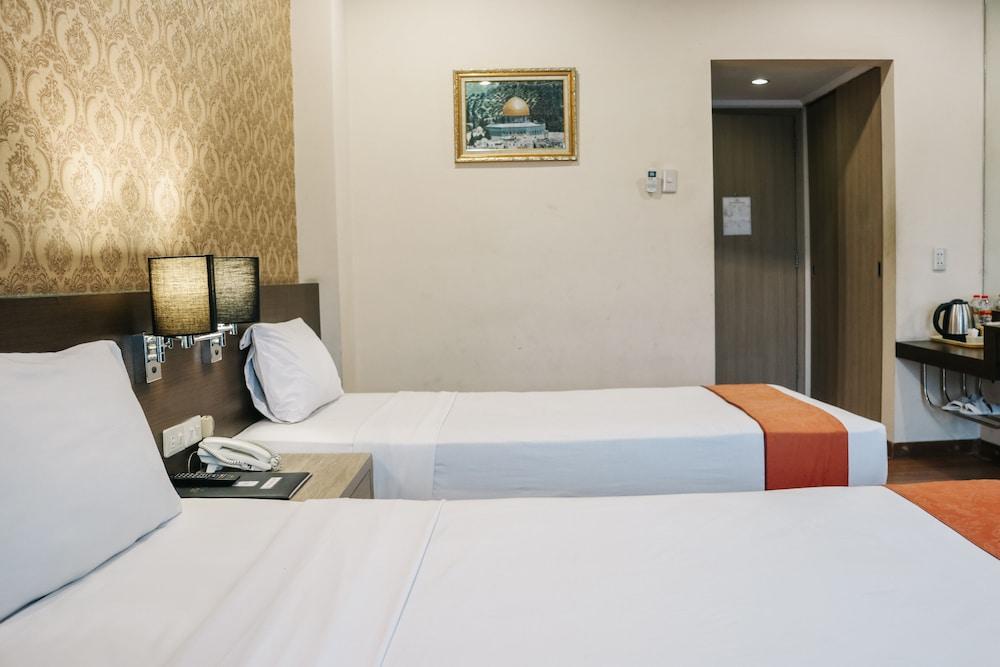 The Amrani Syariah Hotel - Room