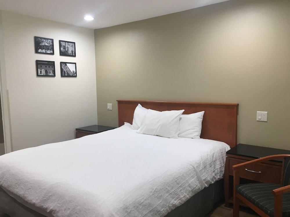 Simply Home Inn & Suites - Room