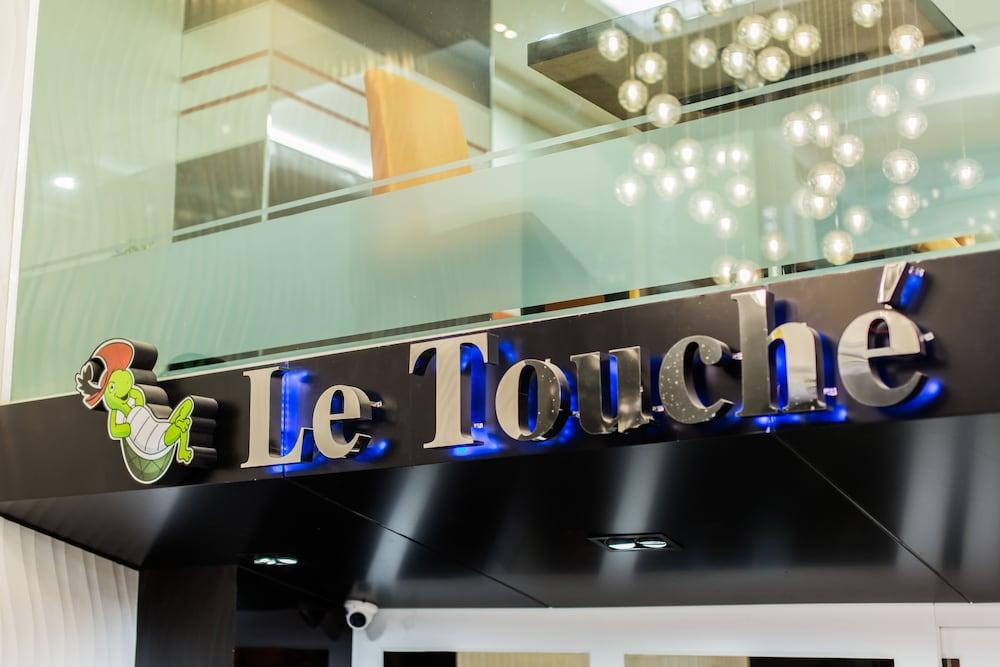 Le Touche' - Featured Image