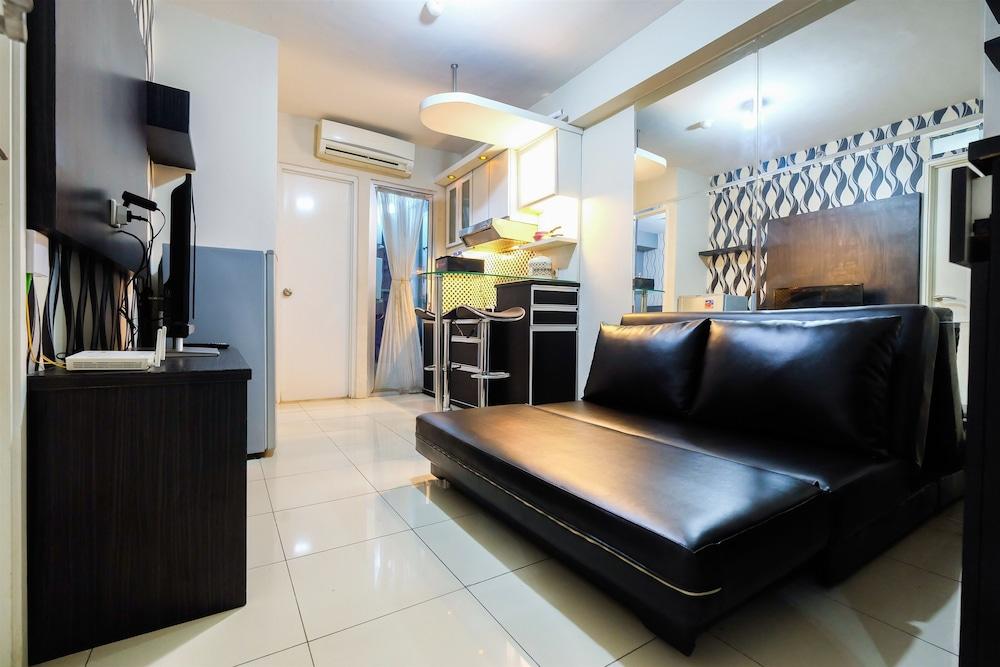Monochrome Style 2 Bedrooms at Kalibata City Apartment By Travelio - Featured Image